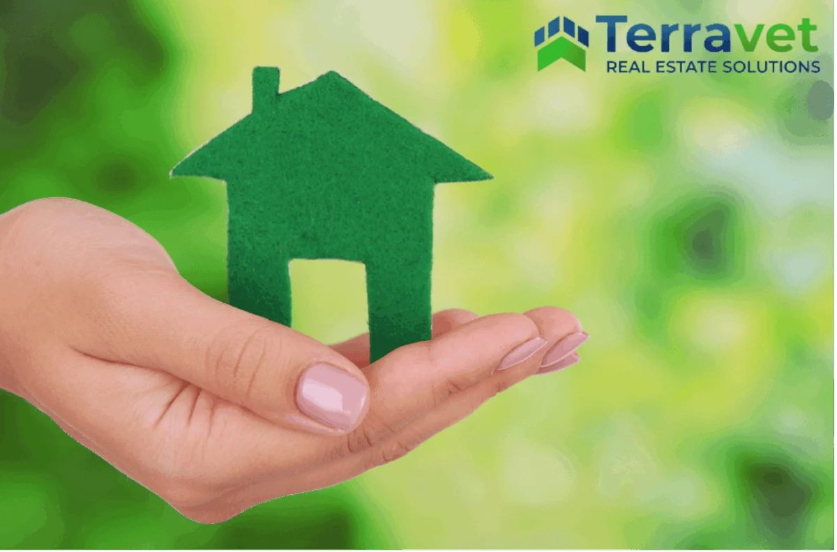 Felt house in persons hand representing Terravet building green veterinary property.