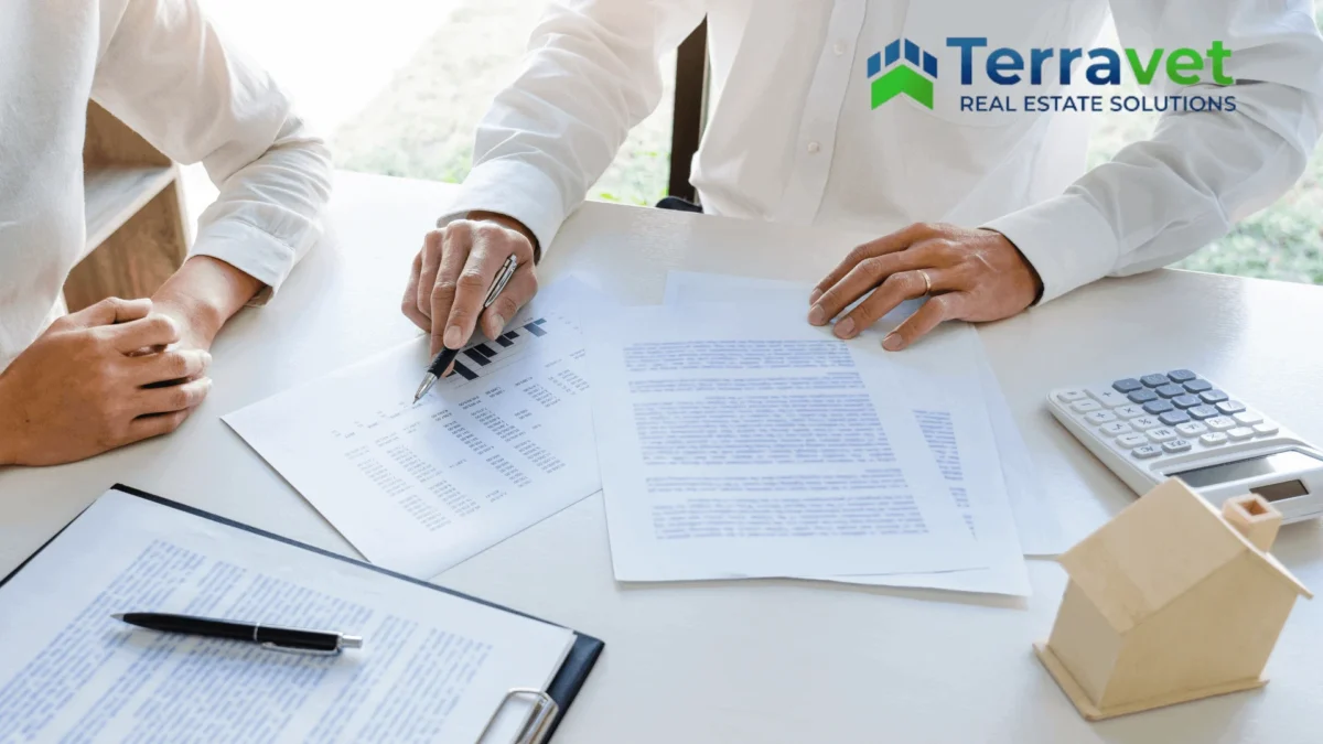 Two people discussing documents representing CapEx Reserve and future of Veterinary Practice planning