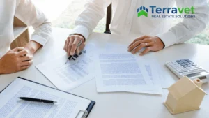 Two people discussing documents representing CapEx Reserve and future of Veterinary Practice planning