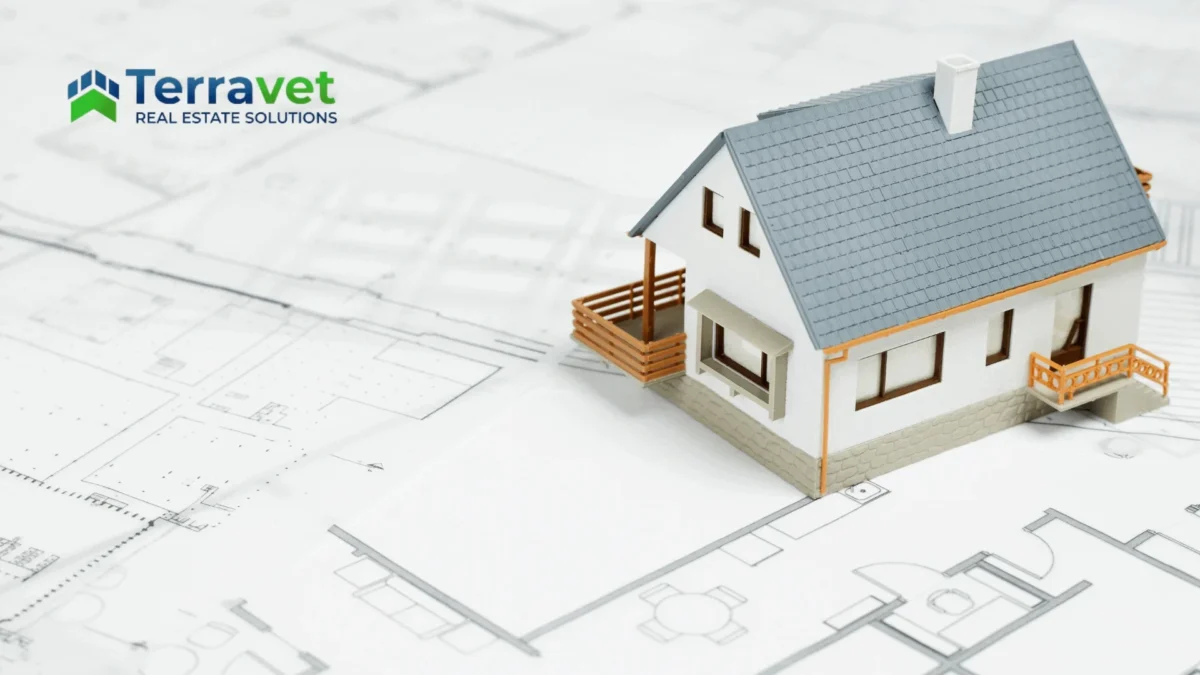 Property model sitting on architecture plans representing repositioning veterinary property