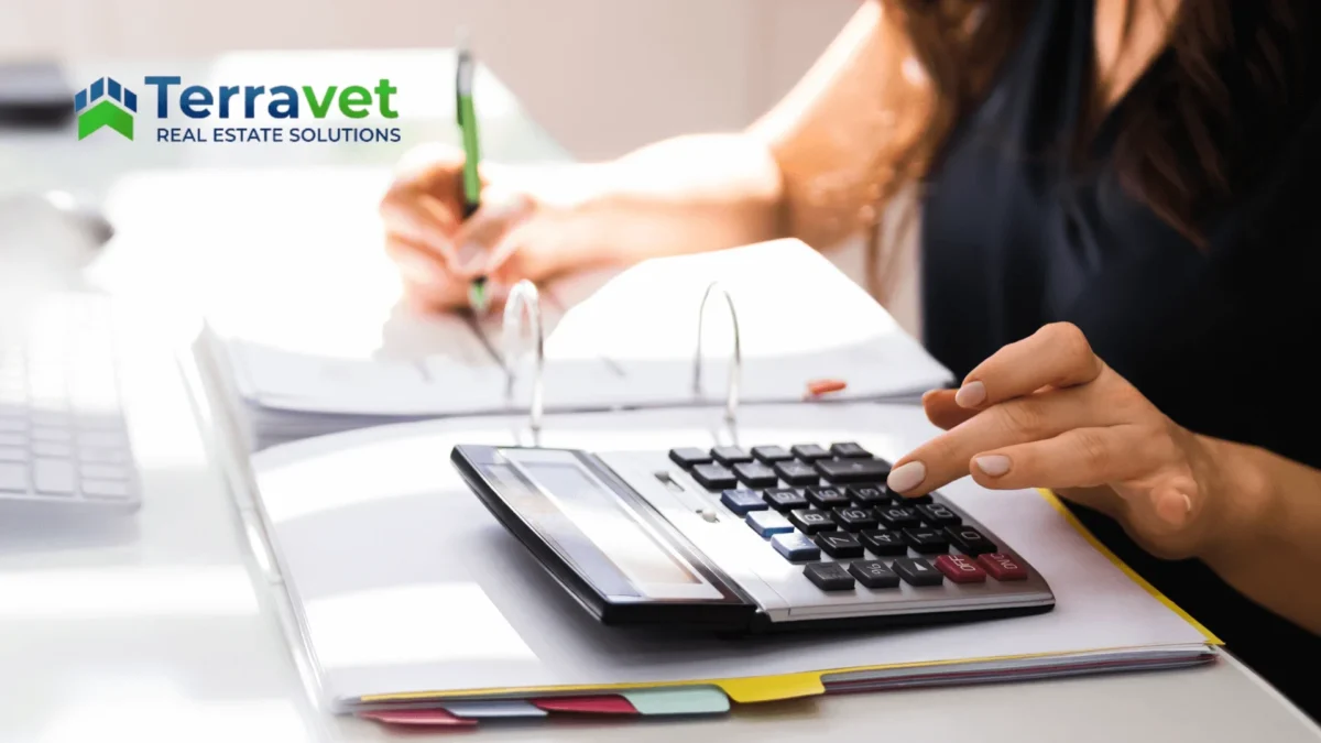 TerraVet Real Estate Solutions Logo ontop of woman using calculator representing Cost segregation study