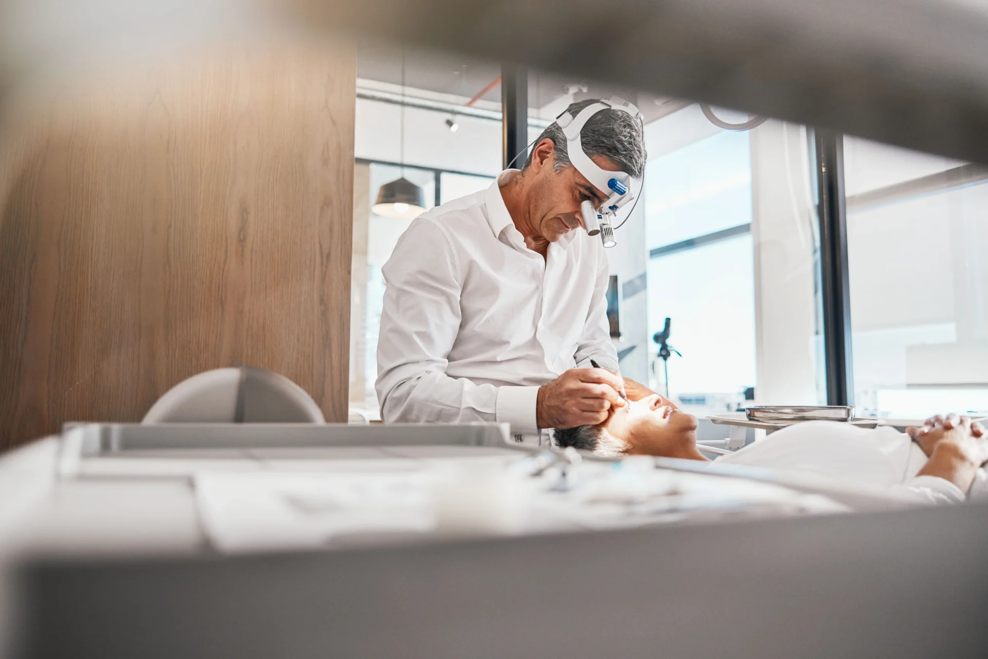 Ophthalmologist examining the eyes of patient
